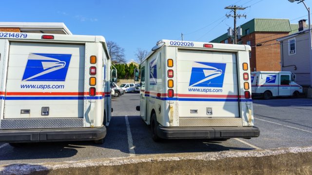 USPA Mail delivery trucks parked at the Ephrata Post Office in Lancaster County, PA.