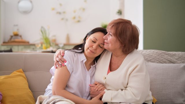 tender image of an elderly mother and her adult daughter emphasizes the emotional aspects of aging in place, discussing how families can work together to ensure comfort and safety of their loved one