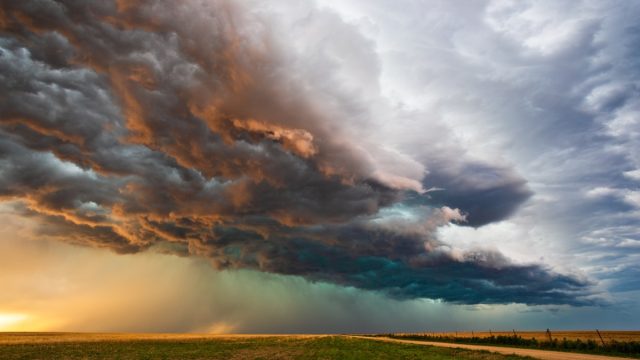Stormy sky with dramatic clouds from an approaching thunderstorm at sunset