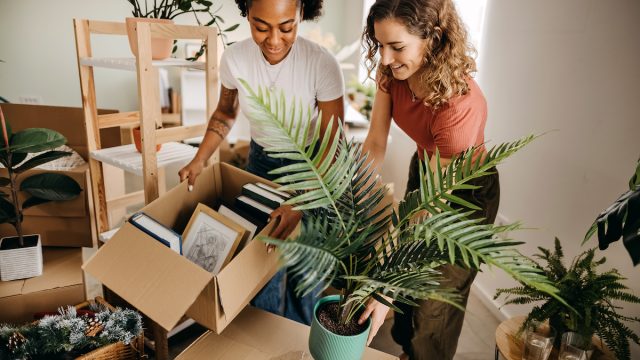 A female friend helping her female friend move