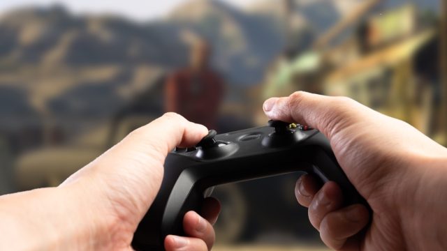 POV of gamer holding a controler