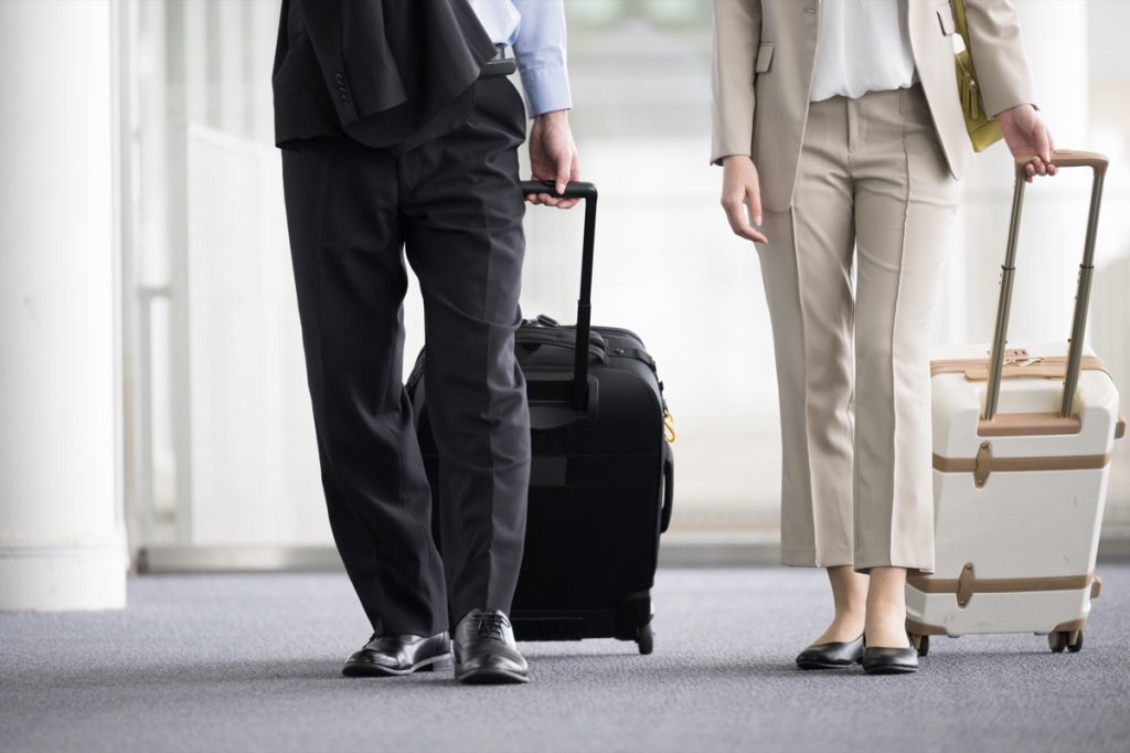 two people talking at airport
