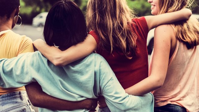 Group of Friends Hugging from Behind