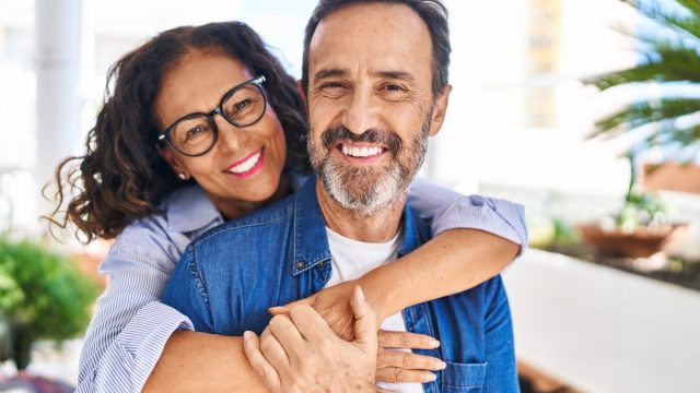 woman hugging man from behind