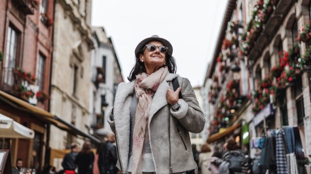 happy mature woman wearing coat