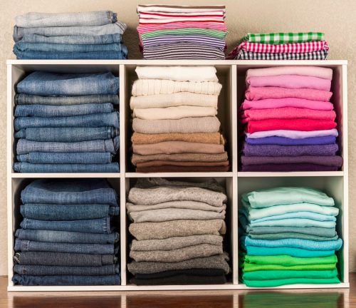 color coded clothes on shelves
