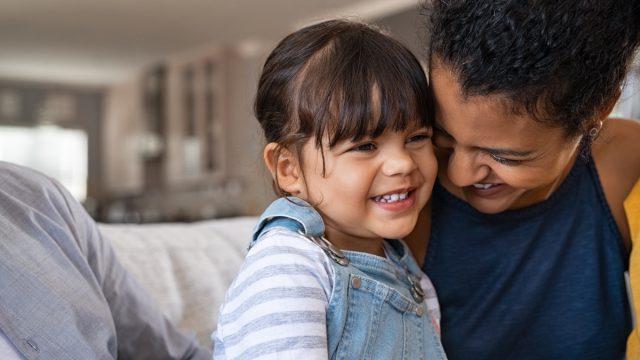 mom and daughter laughing over jokes for kids
