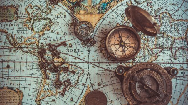 pirate items including a compass and vintage map