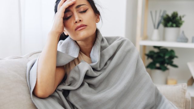 woman sick at home with covid