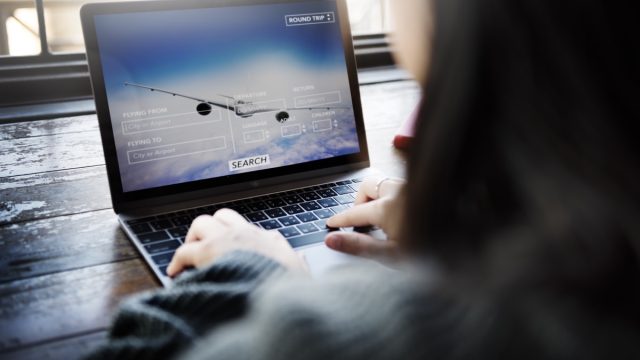 woman booking flight online