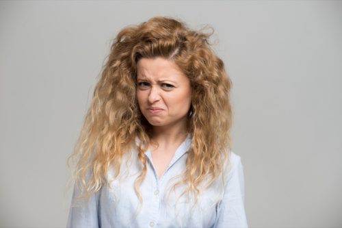 Woman making a disgusted expression