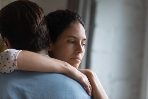 Couple Hugging after a Breakup