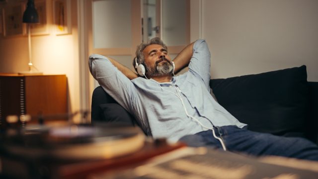 middle aged man listening to music