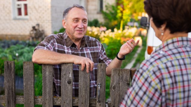 Neighbors Talking Over the Fence