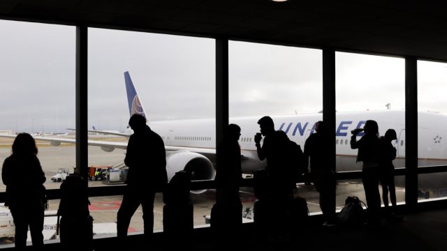 passengers getting ready to board united flight