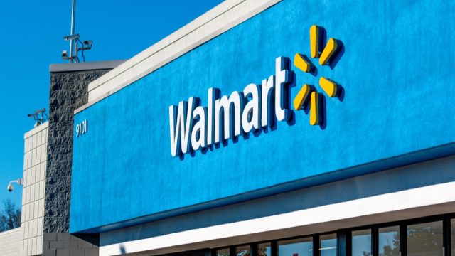 Closeup of the name and logo on a blue walmart store