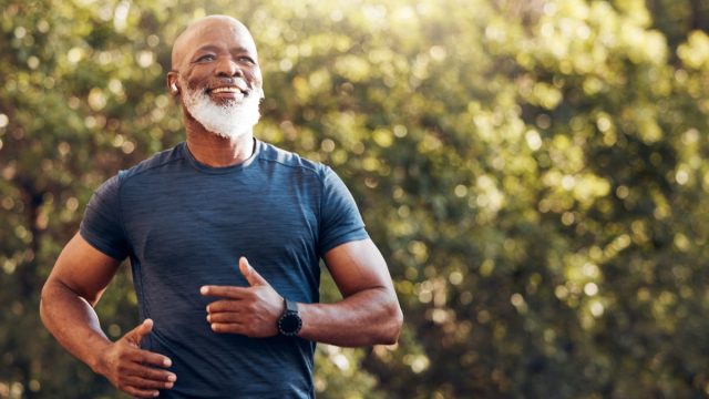 Healthy older man going for a run