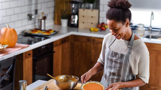 Young Black Woman Making Pie