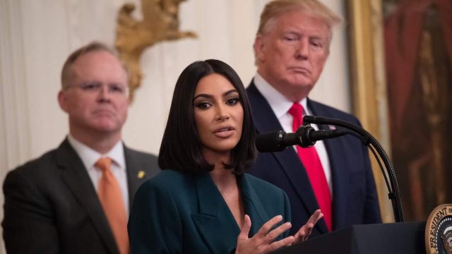 Kim Kardashian speaking at the White House alongside Donald Trump in 2019