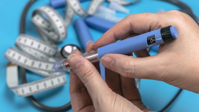 person using ozempic or wegovy injection