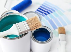 paint cans, swatches, and brushes