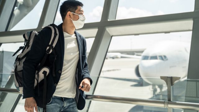 masked man at airport
