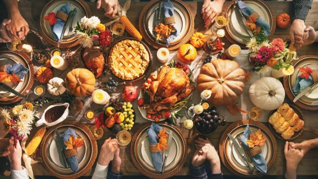 aerial view of a thanksgiving table full of traditional foods
