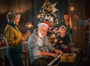 Family Singing Christmas Songs by Piano