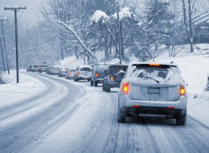 Line of Cars Driving in Snow