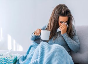 woman home sick with covid