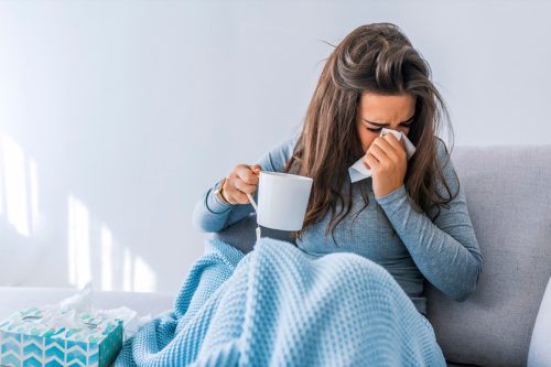 woman home sick with covid