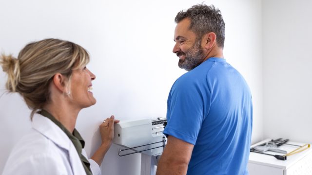 man talking to doctor about weight loss