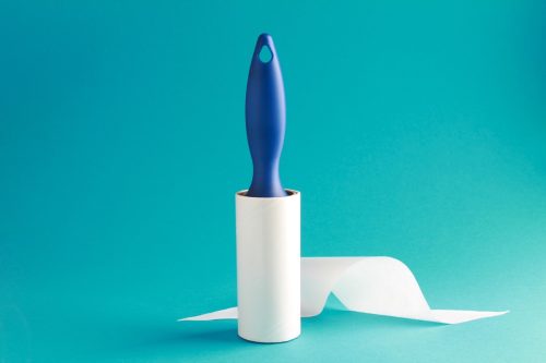 lint roller on blue background