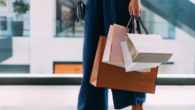 An Unrecognizable Beautiful Woman Holding Her Shopping Bags