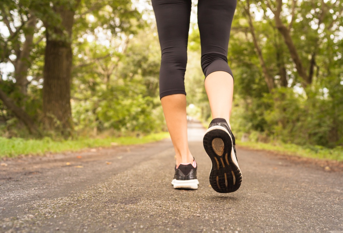 View of a woman's legs taking a walk in nature.