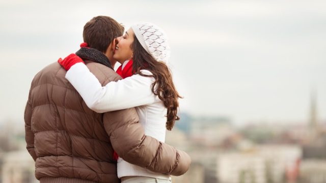 woman whispering cute things to her boyfriend