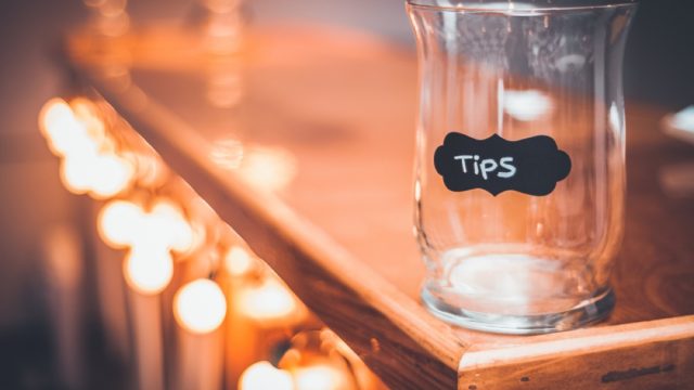 empty tip jar on a bar counter