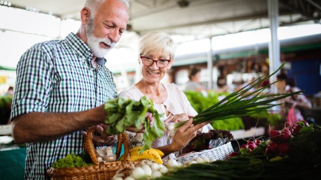 mature couple shopping at farmer's market