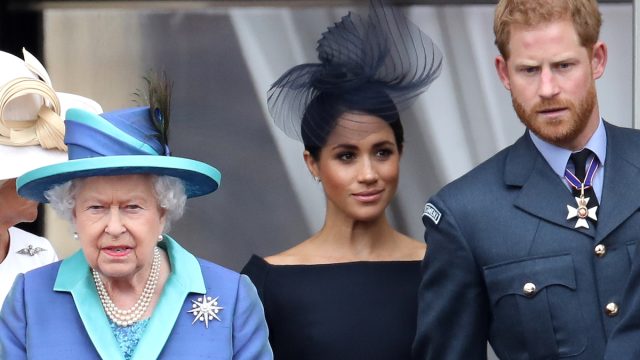 Queen Elizabeth, Meghan Markle, and Prince Harry on the balcony of Buckingham Palace in 2018