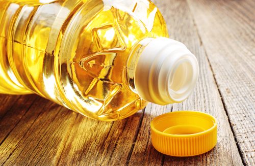Close up of a bottle of vegetable oil on its side