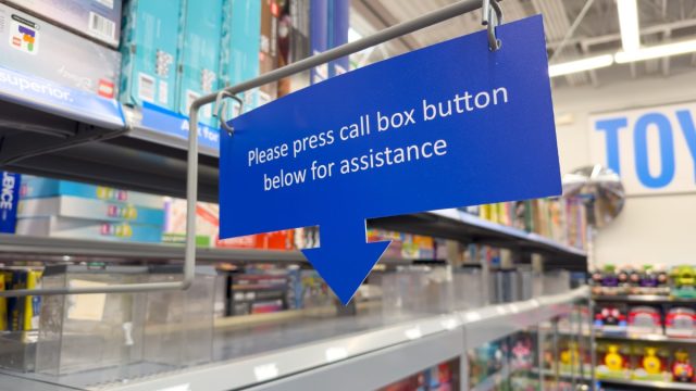 Los Angeles, CA - Dec 17, 2023: Please press call box button below for assistance sign at Walmart store.