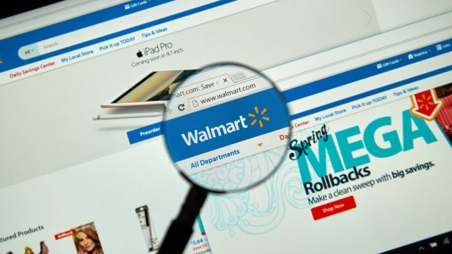 Walmart internet page under magnifying glass.
