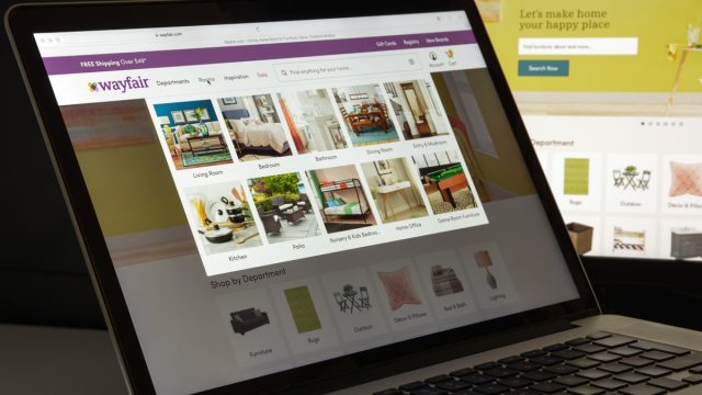 laptop screen showing a person shopping on wayfair