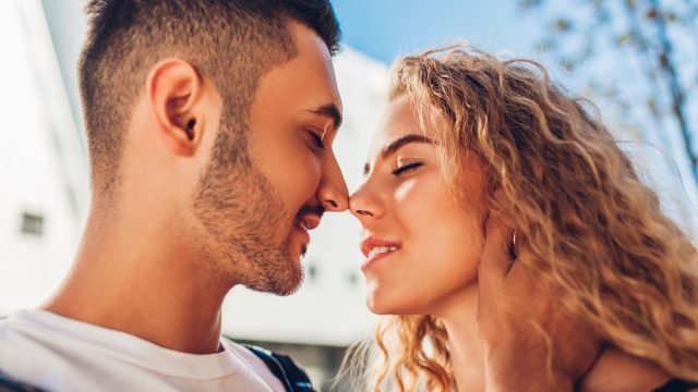 Young couple about to kiss.
