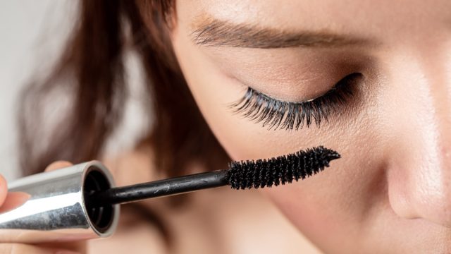 Close up of Woman Putting on Mascara