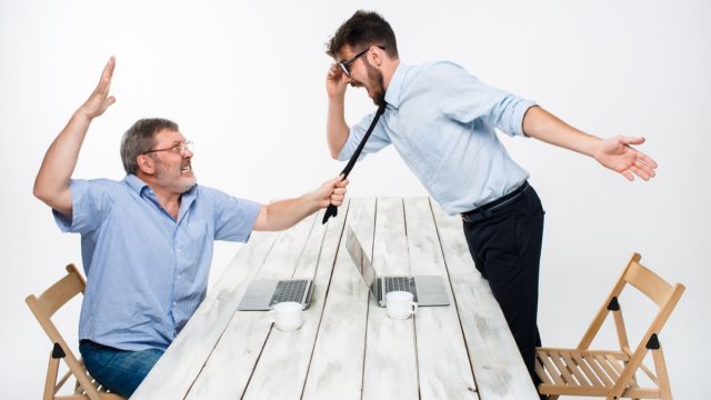 two colleagues having a comical argument