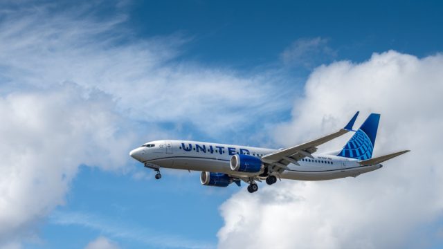 Miami, USA - February 16, 2023: United Airlines airplane (Boeing 737-8 Max) landing at Miami International Airport. United Airlines is the third-largest airline in the world after its merger with Continental Airlines.