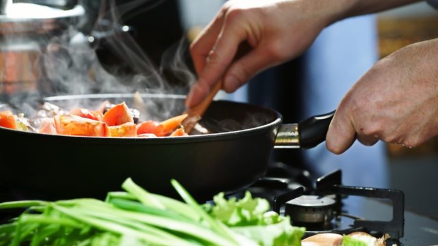Chef prepares hotpot in the stew pan in the kitchen