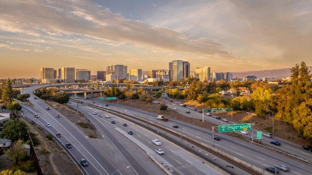 An aerial view of San Jose, California, with the highway in the foreground