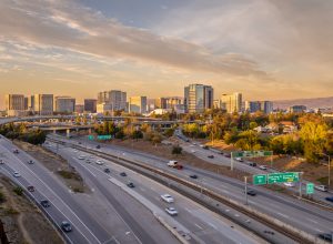 An aerial view of San Jose, California, with the highway in the foreground